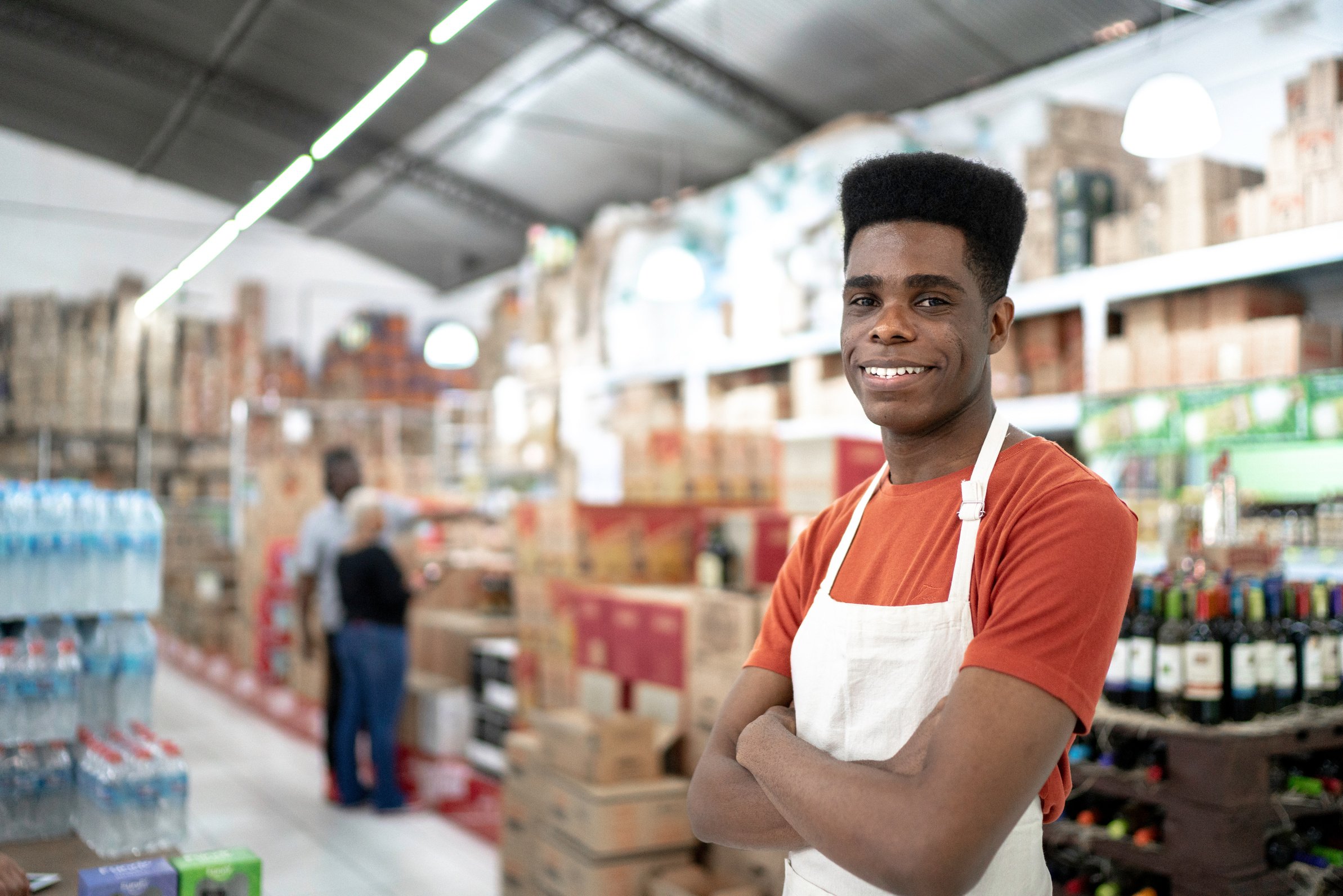 African smiling young employee portrait at wholesale