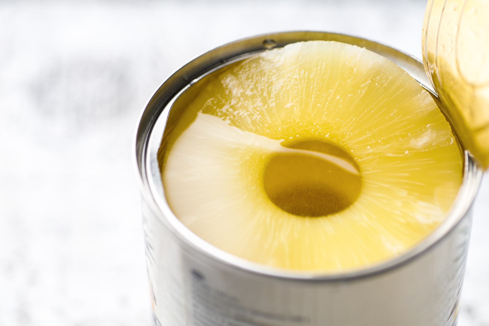 Open tin of canned pineapple